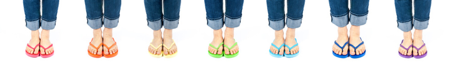 Row of Feet Wearing Colorful Flip Flops