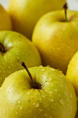 Drop of water on green apple