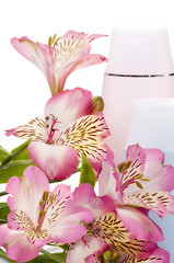 Two plastic bottles  and pink flowers