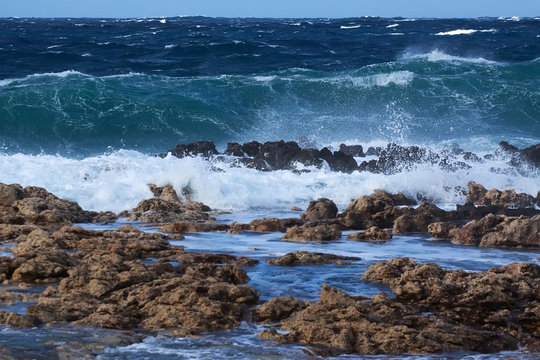 Sea wave breaking against coast  rock