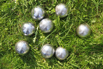 petanque bowls in the green grass