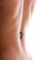 woman with slavonic sun rune tattoo on back