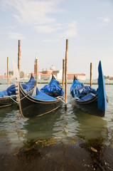Fototapeta na wymiar gondolas in Grand Canal Venice Italy famous church in background