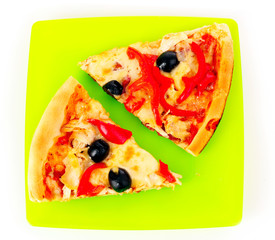 Pizza with olives and tomatoes closeup on green plate