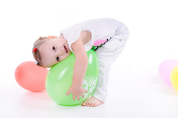 little girl playing with a balloon