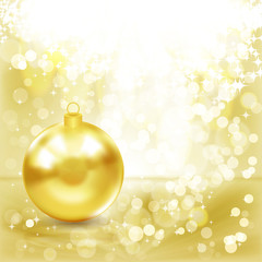 Naklejka na ściany i meble Gold Christmas ball on a golden light background.