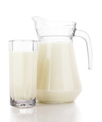 Pitcher and Glass with milk isolated on white