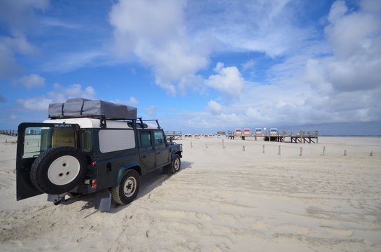 beach of St. Peter Ording with SUV