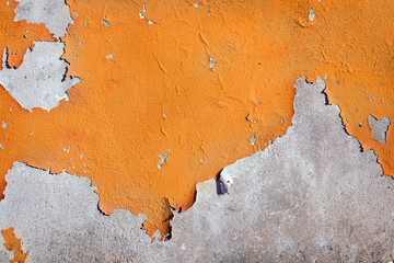 close-up of peeling painted cement wall