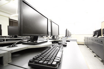 workplace room with computers in row