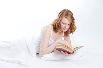 young beautiful girl reads book