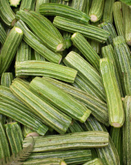 Fresh chopped Roman zucchinis on display at an Italian outdoors