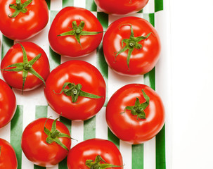 tomatoes on striped tray