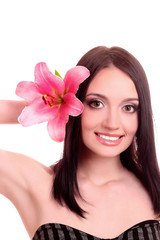 Obraz na płótnie Canvas Beautiful young woman with lily flower