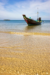 Obraz premium Boat in the tropical sea