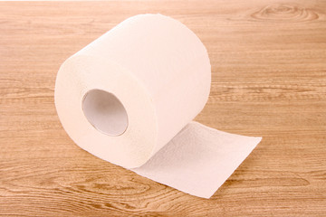 Toilet paper on wooden table