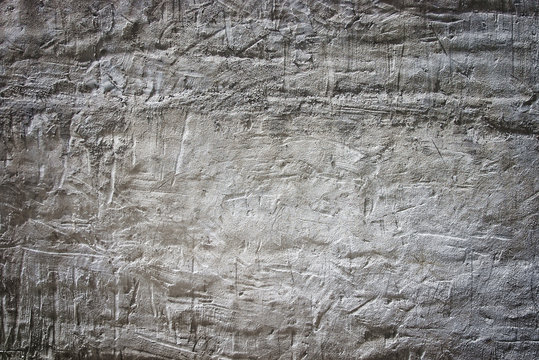 Grungy white limestone wall with scratches and light falloff