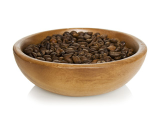 Coffee beans in wooden bowl isolated on white