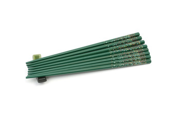 Eight green chopsticks on a support