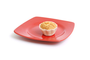 Fruitcake on a red plate