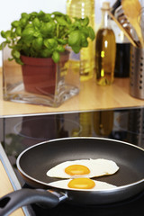 Fried eggs in pan
