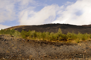 Lava covered slopes of  volcano Mount Etna in Sicily Italy