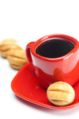 cup with coffee and cake nut isolated on white
