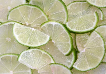 Tableaux ronds sur aluminium brossé Tranches de fruits Citrons verts tranchés