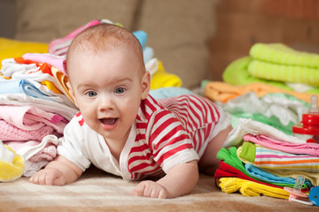 Fototapeta na wymiar baby girl with children's clothes