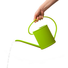 hand holding watering can isolated - obrazy, fototapety, plakaty