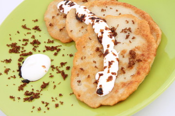 Potato pan cakes with cream and brown sugar