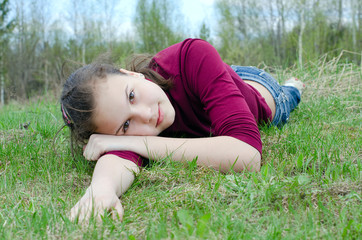 Portrait of the girl against the blue sky