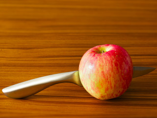 red apple with knife