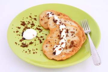 Potato pan cakes with cream and brown sugar