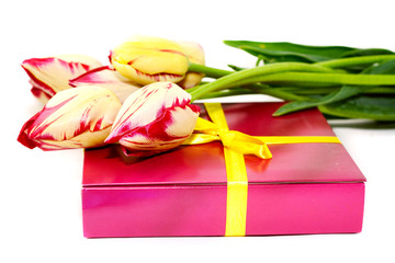 Gift and a bouquet of yellow tulips