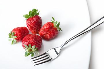 strawberries on plate with fork