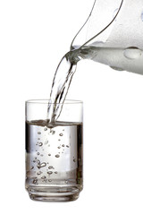 Filling a glass with water on white background