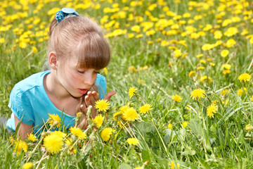 Fototapeta premium Child lying on grass in flower.