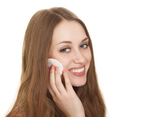 Happy woman caring about her fresh healthy skin of face with cot