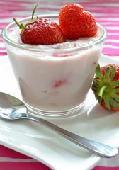 A dessert glass with fresh strawberry semolina pudding