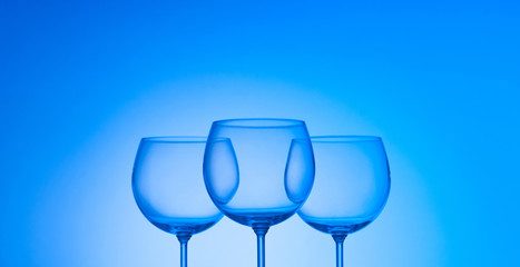 Wine glasses against gradient background