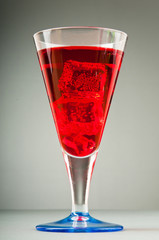 Colourful cocktail in glasses with ice