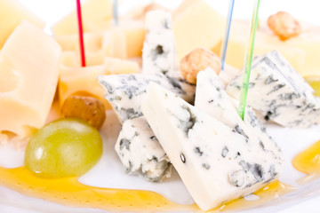 Cheese. A plate of cheeses.