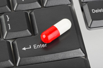 Pills on computer keyboard
