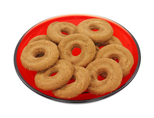 Chocolate shortbread cookies on red plate.