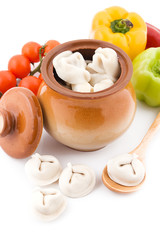 Meat dumplings in pot with vegetables