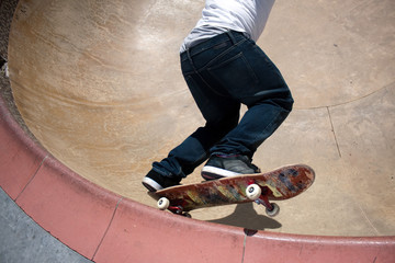 Skateboarder Skating Inside the Bowl