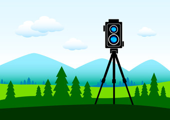 Camera in green landscape