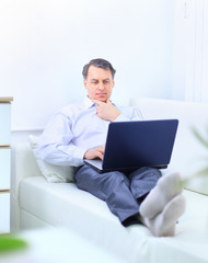 entrepreneur working from home looking very relaxed in