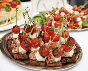 Canapes with choriso wurst on table